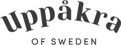 Uppåkra of Sweden logotype in black on white background. ”Uppåkra” in ached text above ”of sweden”.