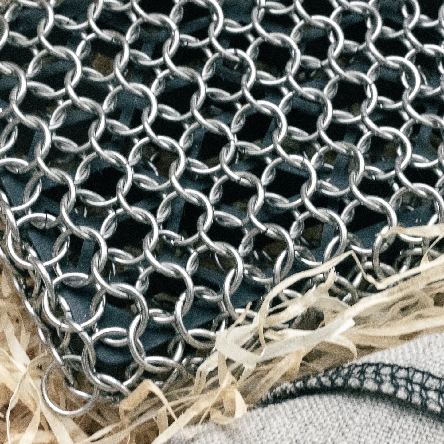 A close-up of the chainmail covering a silicon pad.